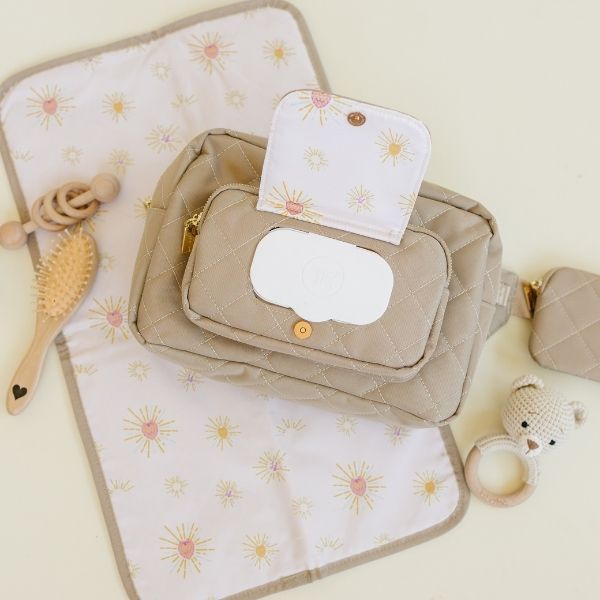 Compact diaper bag with easy-access wipes pocket and changing pad