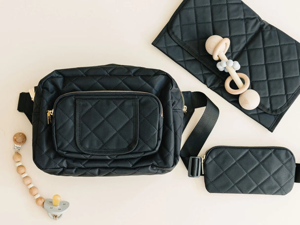 Lightweight black crossbody diaper bag with gold hardware