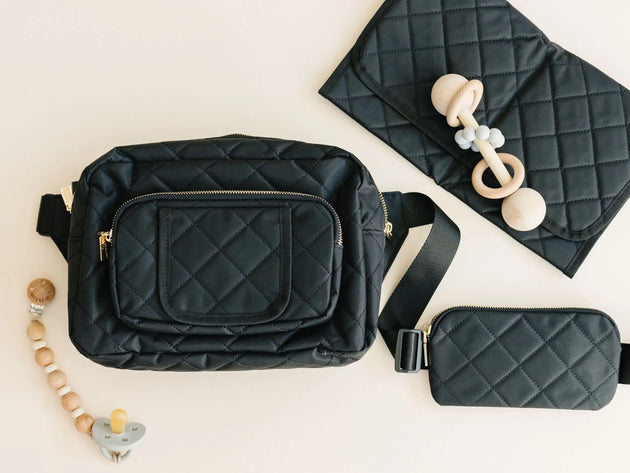 Lightweight black crossbody diaper bag with gold hardware